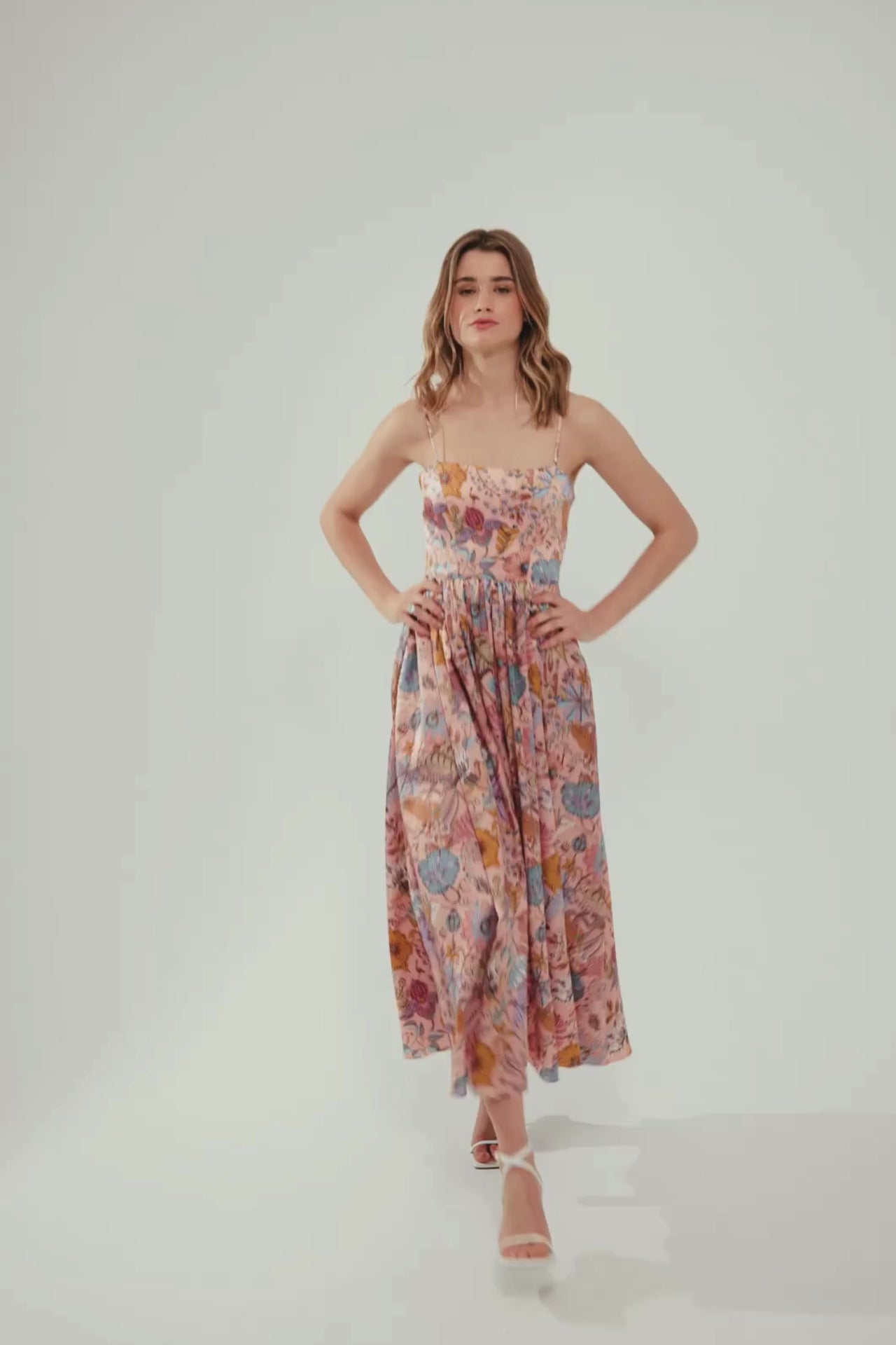 E-commerce video with a model waling in maxi pink dress