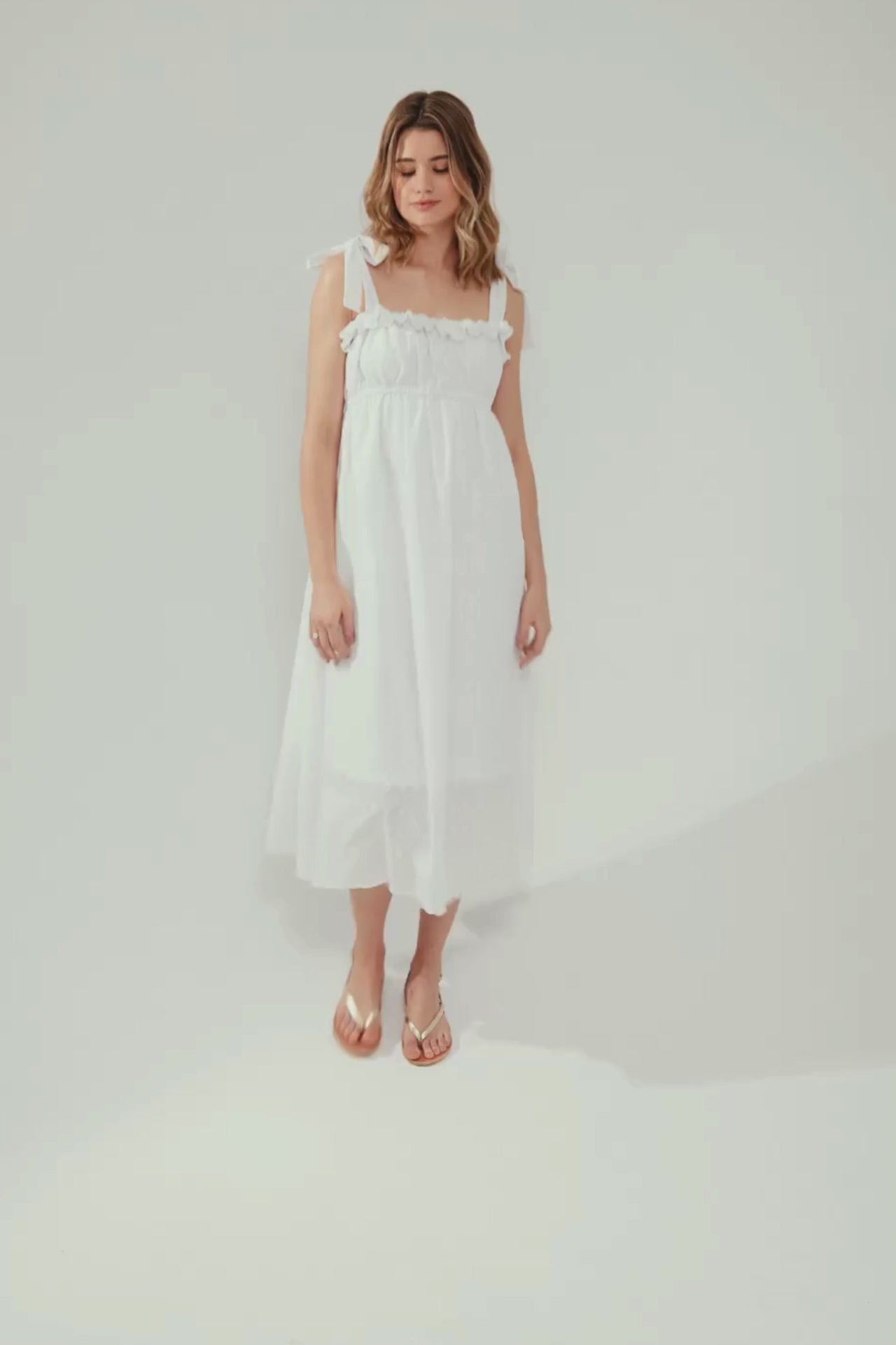 E-commerce video with a model waling in maxi white dress